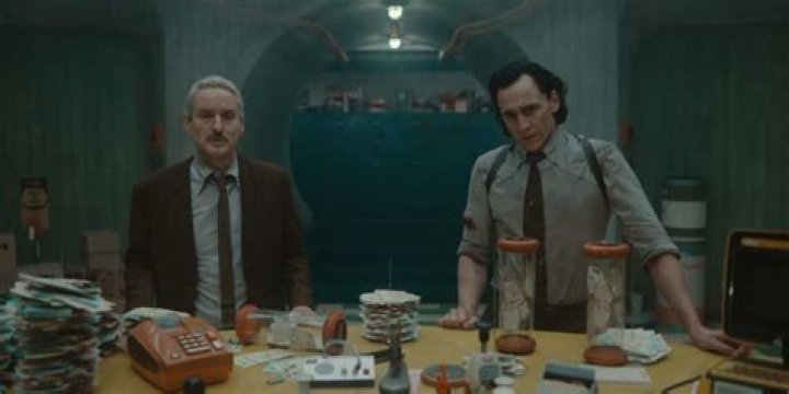 Loki and Mobius walk past a poster for a movie called 'Phone Ranger' in 'Loki' season 2 episode 2.